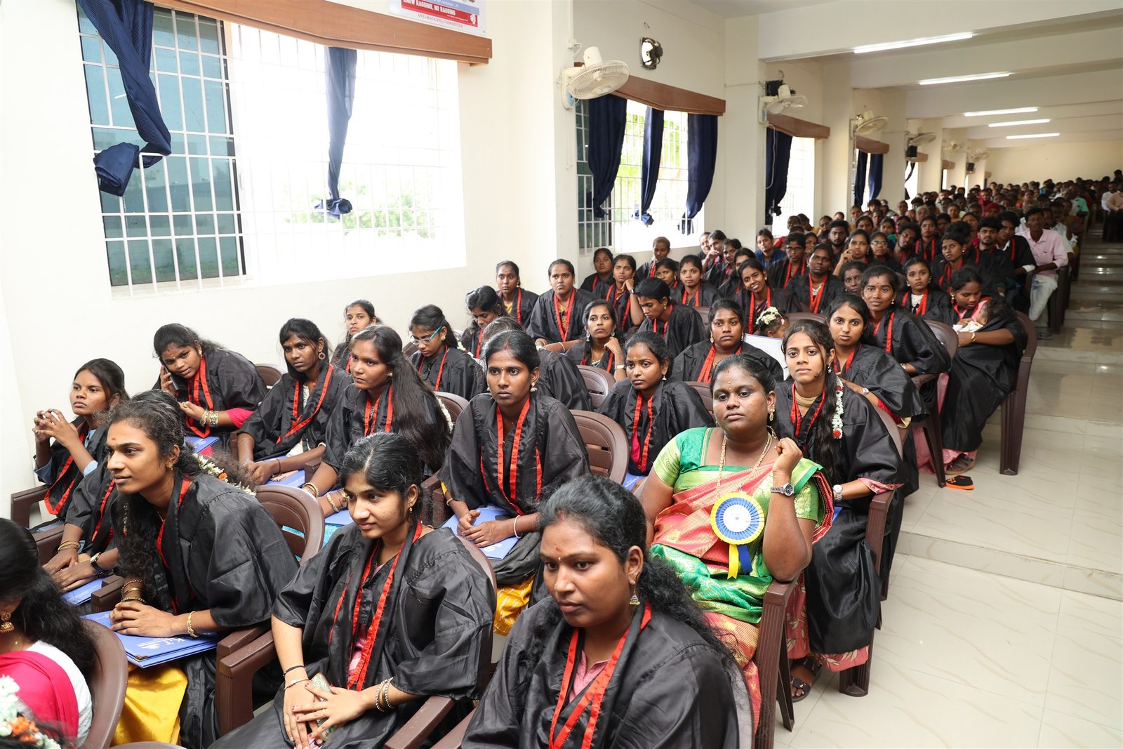 Graduates in gowns at the college's 12th Graduation Day